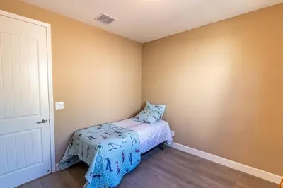 a small bedroom with a bed in the corner at Sierra Vista Retreat - Reno Tahoe in Reno