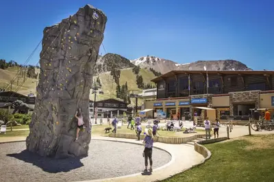a group of people playing on a rock wall at Hidden Valley 29 D in Mammoth Lakes