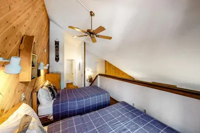 a bedroom with two beds and a ceiling fan at Hidden Valley 114 I in Mammoth Lakes
