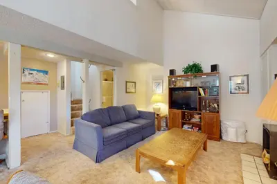 a living room with a couch and a tv at Hidden Valley 30 D in Mammoth Lakes