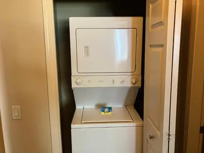 a microwave oven sitting on top of a refrigerator at Mammoth Green 110 in Mammoth Lakes