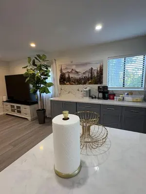 a kitchen with a table and a counter top at Newly Renovated Lakefront with Dock in Bethel Island