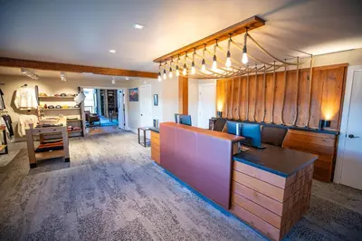 a dressing room with a counter and a table at Outbound Mammoth in Mammoth Lakes