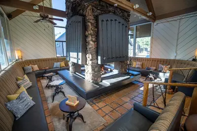 an overhead view of a lobby with a fireplace at Outbound Mammoth in Mammoth Lakes