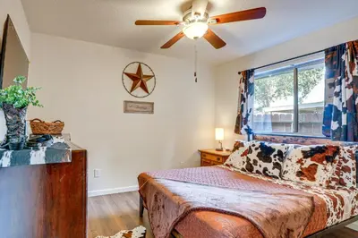a bedroom with a bed and a ceiling fan at Pet-Friendly Yard! Home 3 Mi to Sky River Casino in Elk Grove