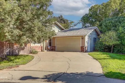 a house with a driveway and a garage at Pet-Friendly Yard! Home 3 Mi to Sky River Casino in Elk Grove