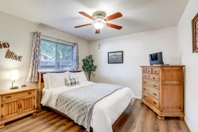 a bedroom with a bed and a ceiling fan at Pet-Friendly Yard! Home 3 Mi to Sky River Casino in Elk Grove