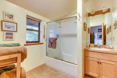 a bathroom with a shower and a sink at 1 Mi to Skiing! Cabin Hideaway on June Lake Loop in June Lake