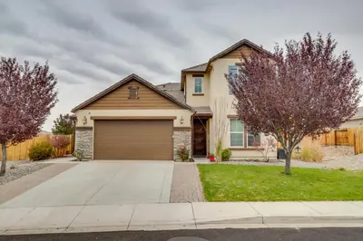 a house with a garage in a residential neighborhood at Family-Friendly Retreat with Playground in Reno! in Reno