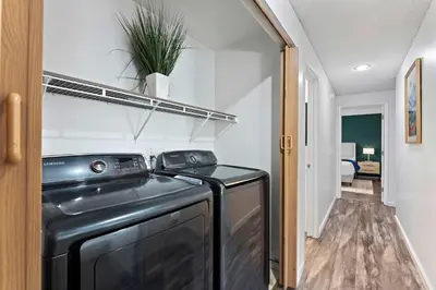 a black washer and dryer in a room at Family 4BR Home with Patio by Willowcreek Park in Sparks