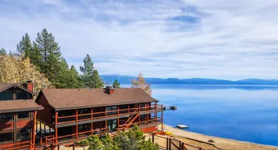 a house on the shore of a lake at Tahoe Edgelake Beach Club by Coolvacay in Tahoe Vista