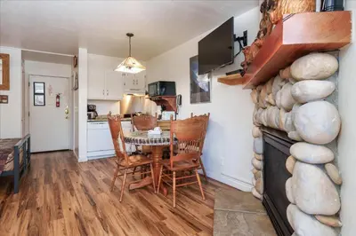 a kitchen and dining room with a table and chairs at (A111) Studio Condominiums in Yosemite West