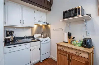 a small kitchen with a sink and a microwave at (A202) Loft Condominiums in Yosemite West
