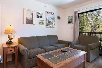 a living room with a couch and a coffee table at (A110) Studio Condominiums in Yosemite West