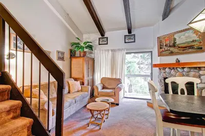 a living room with a couch and a chair at (A203) Loft Condominiums in Yosemite West