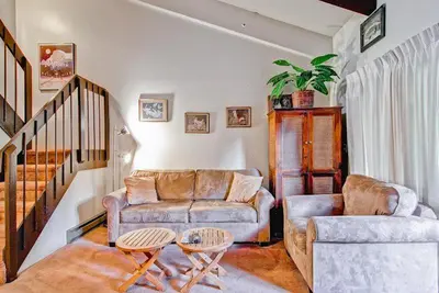 a living room with a couch and two tables at (A203) Loft Condominiums in Yosemite West