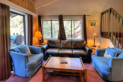 a living room with a couch and two chairs and a table at (A207) Loft Condominiums in Yosemite West