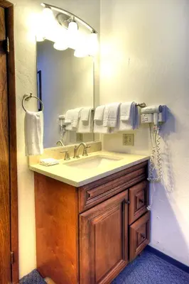 a bathroom with a sink and a mirror at (A211) Loft Condominiums in Yosemite West