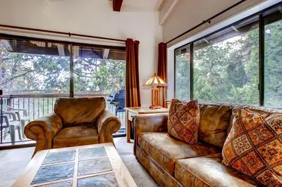 a living room with a couch and a chair at (B207) Loft Condominiums in Yosemite West