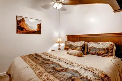 a bedroom with a large bed in a room at (B207) Loft Condominiums in Yosemite West