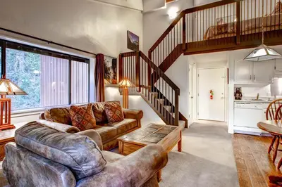 a living room with a couch and a table at (B207) Loft Condominiums in Yosemite West