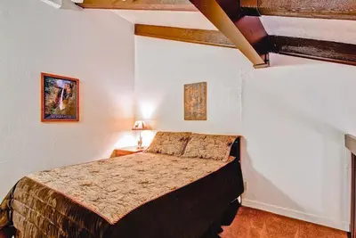 a bedroom with a bed in a room at (B211) Loft Condominiums in Yosemite West