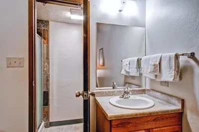 a bathroom with a sink and a mirror at (B211) Loft Condominiums in Yosemite West