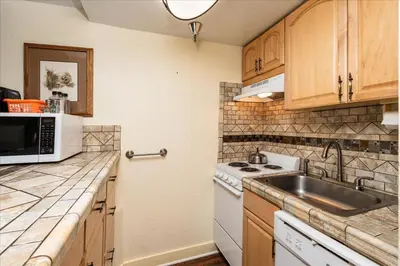 a kitchen with a sink and a stove at (B208) Loft Condominiums in Yosemite West