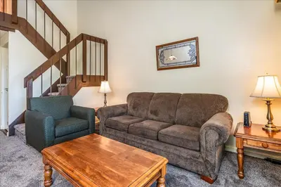a living room with a couch and a chair at (B208) Loft Condominiums in Yosemite West
