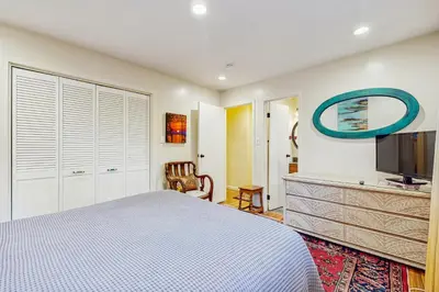 a bedroom with a bed and a flat screen tv at Colorado Pines Retreat in South Lake Tahoe