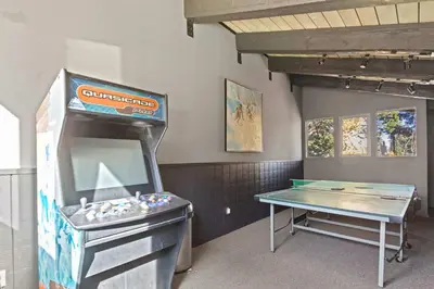 a ping pong table in a room with a game at Chamonix #15 - Cozy Mtn Retreat with Fireplace in Mammoth Lakes