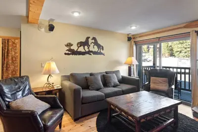 a living room with a couch and chairs and a table at Chamonix #15 - Cozy Mtn Retreat with Fireplace in Mammoth Lakes