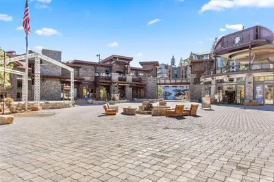 a courtyard with couches and chairs in a building at The Village #2408 - Village Center Cozy Getaway w Fireplace in Mammoth Lakes