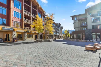 an empty street in a city with buildings at The Village #2408 - Village Center Cozy Getaway w Fireplace in Mammoth Lakes