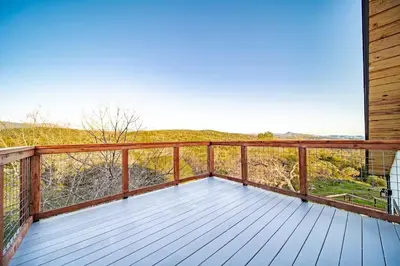 a deck with a view of the mountains at Hilltop Luxury Yosemite Retreat with Spa, Pool, Views in Mariposa