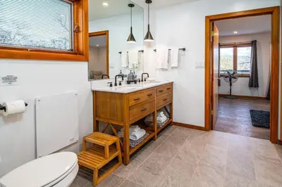 a bathroom with a sink and a toilet at Hilltop Luxury Yosemite Retreat with Spa, Pool, Views in Mariposa