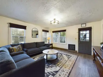 a living room with a couch and a table at Family Getaway Near Yosemite - Downtown Mariposa in Mariposa