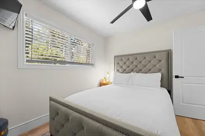 a bedroom with a bed and a ceiling fan at Luxury Hyatt Oasis 3 Bedrms 1 Bath SFH for Fun Ski home in South Lake Tahoe