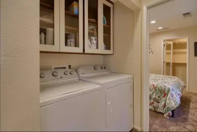 a white washer and dryer in a laundry room at Hillside Bungalow - Walking distance to downtown in Mariposa