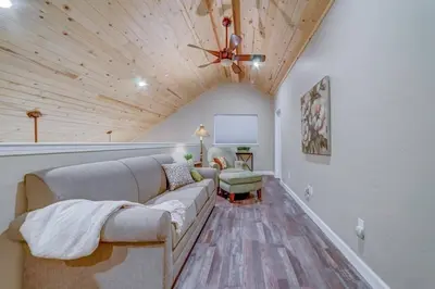 a living room with a couch and a ceiling fan at Butterfly View Retreat - 45 Min to Yosemite in Mariposa