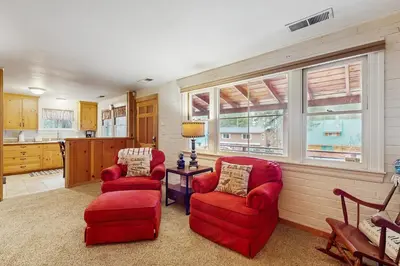 two red chairs and a table in a kitchen at Basecamp on Aspen in South Lake Tahoe