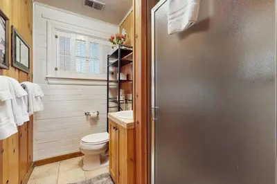a bathroom with a toilet and a sink and a shower at Basecamp on Aspen in South Lake Tahoe