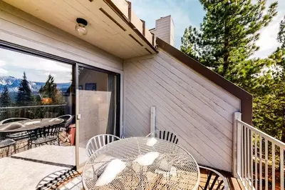 a patio with a table and chairs on a balcony at Eagle's Nest in Big Creek