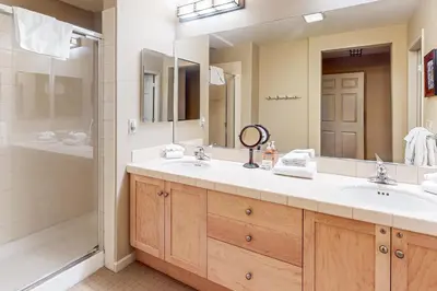 a bathroom with two sinks and a shower at Mammoth Green - 207 in Mammoth Lakes