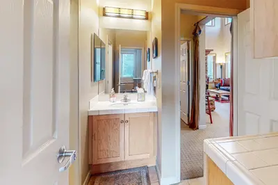 a bathroom with a sink and a mirror at Mammoth Green - 207 in Mammoth Lakes