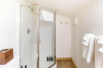 a bathroom with a shower with a glass door at Northstar Resort 2BR Condo with Rec Center Access in Truckee