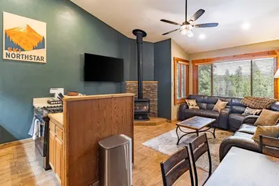 a living room with a couch and a tv at Northstar Resort 2BR Condo with Rec Center Access in Truckee