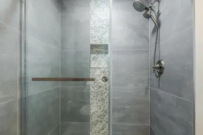 a shower with a glass door in a bathroom at Snowcreek IV 559 in Mammoth Lakes