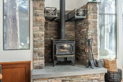 a brick fireplace with a stove in a room at St Moritz 38 in Mammoth Lakes