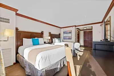 a hotel room with two beds and a television at Studio Suite 2 Queen Beds Mountain View in Tahoe City